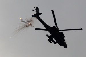 An Israeli Apache helicopter fires flares over the Northern Gaza Strip
