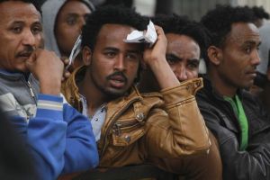 Hundreds of African migrants crowded outside the Ministry of Interior office in downtown Petah Tikvah, waiting to get work visas, on Sunday, March 2, 2014. Photo by Hadas Parush/Flash 90.  *** Local Caption *** ?????? ???????? ?????? ???????? ???? ????? ???? ????? ??? ?????
